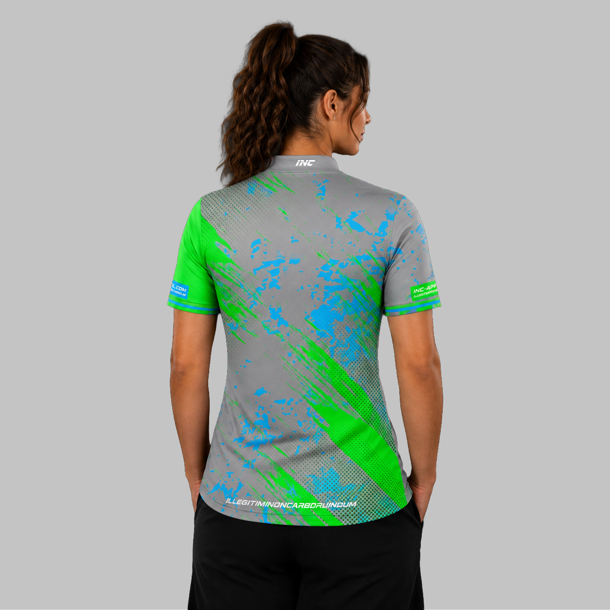 Back view of the Women's Regina grey darts shirt, showcasing the seamless flow of the modern grey graphic pattern across the shoulders.