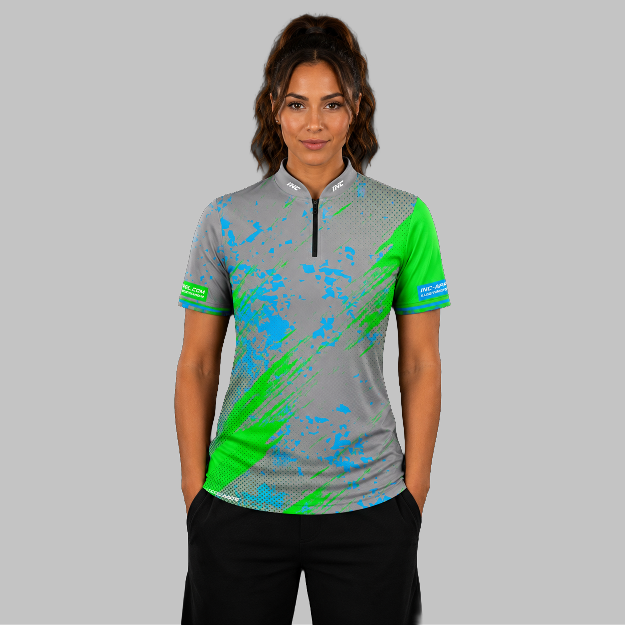 Front view of the Women's Regina grey darts shirt, showing the custom-contoured athletic fit and vibrant sublimated geometric design.