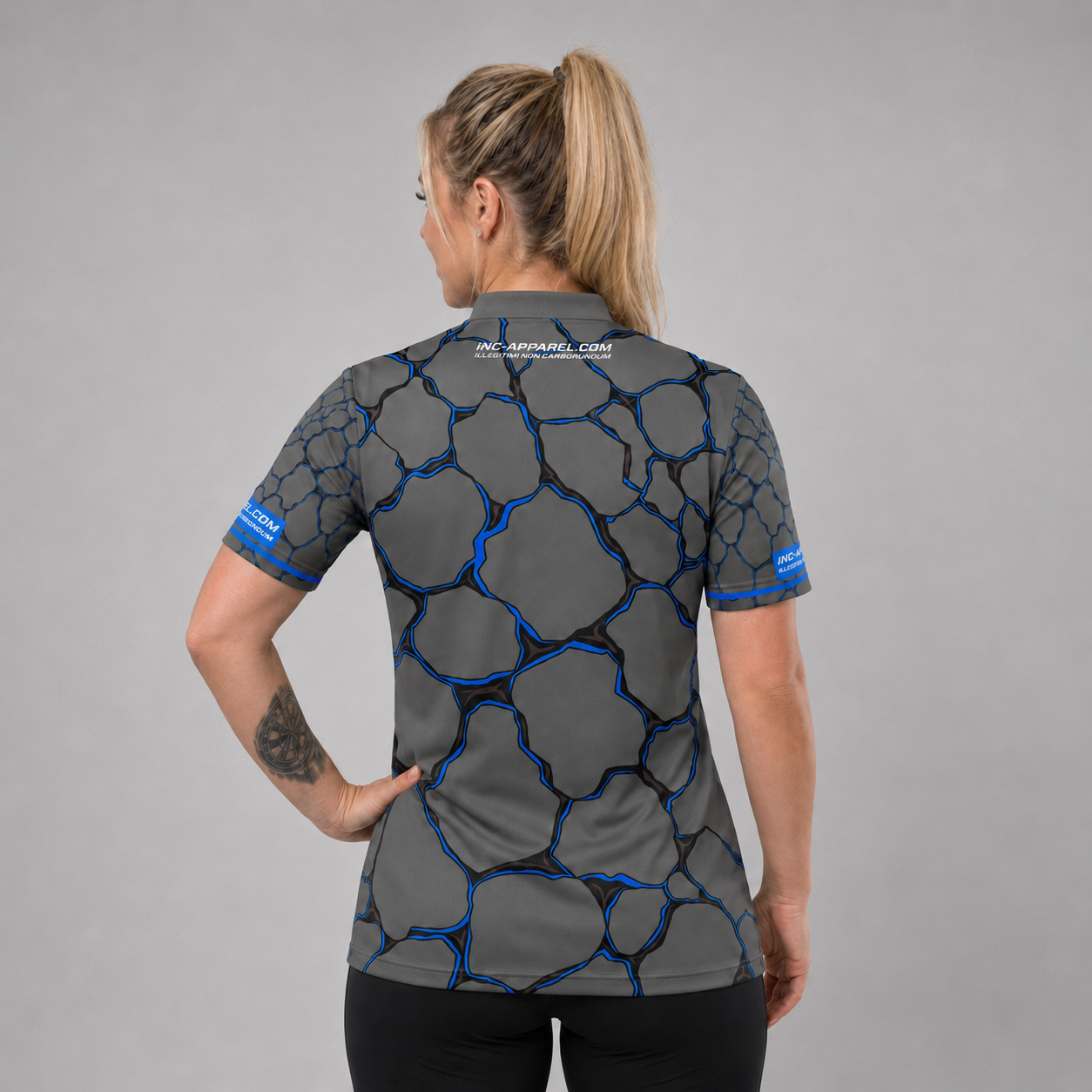 Back view of the Womens Saxosus blue darts shirt, showing the clean continuation of the bold graphic athletic pattern across the back.