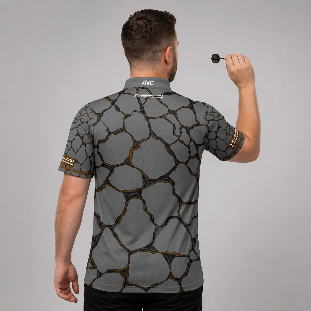 Back view of the Men and Youth Saxosus brown darts shirt, showing the clean continuation of the premium graphic athletic pattern across the back.