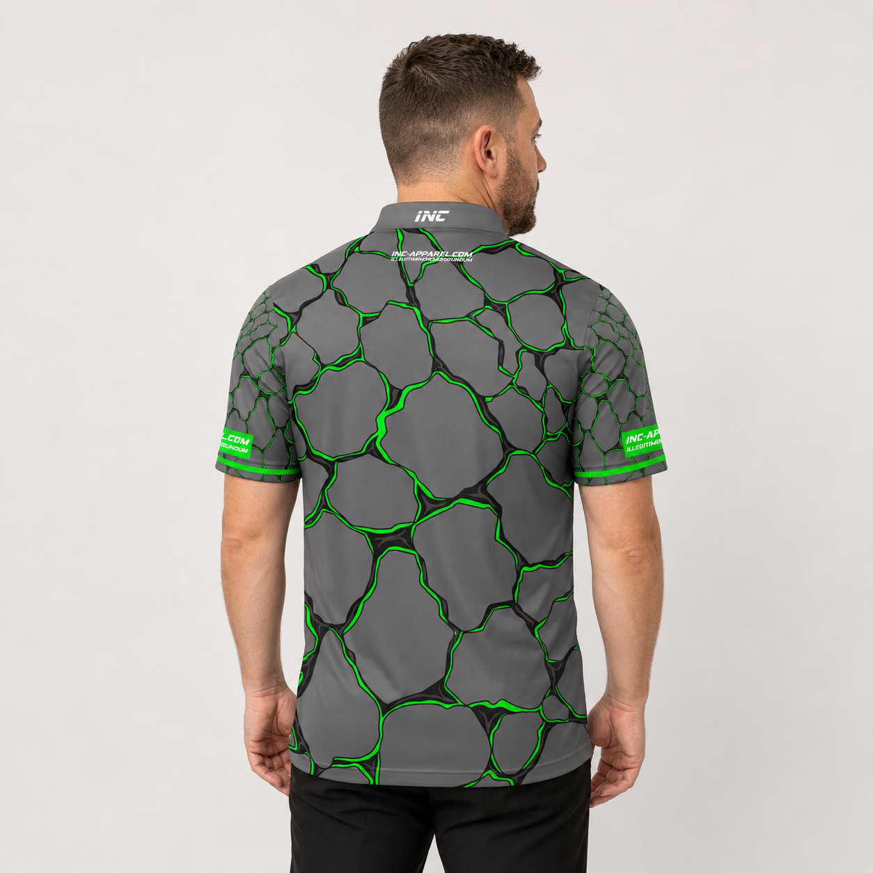 Back view of the Men and Youth Saxosus green darts shirt, showing the clean continuation of the premium graphic athletic pattern across the back.