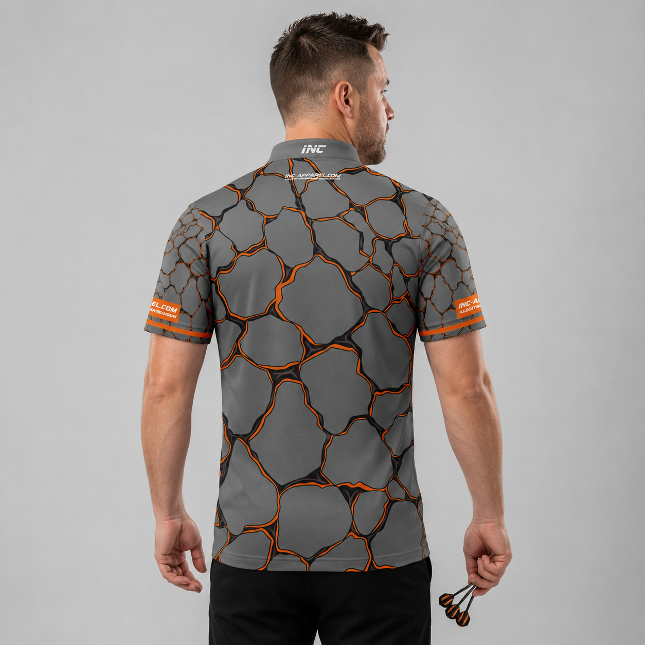 Back view of the Men and Youth Saxosus orange darts shirt, showing the clean continuation of the premium graphic athletic pattern across the back.