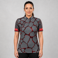 Front view of the Womens Saxosus red darts shirt, featuring a custom tailored athletic jersey design in vibrant shades of red.