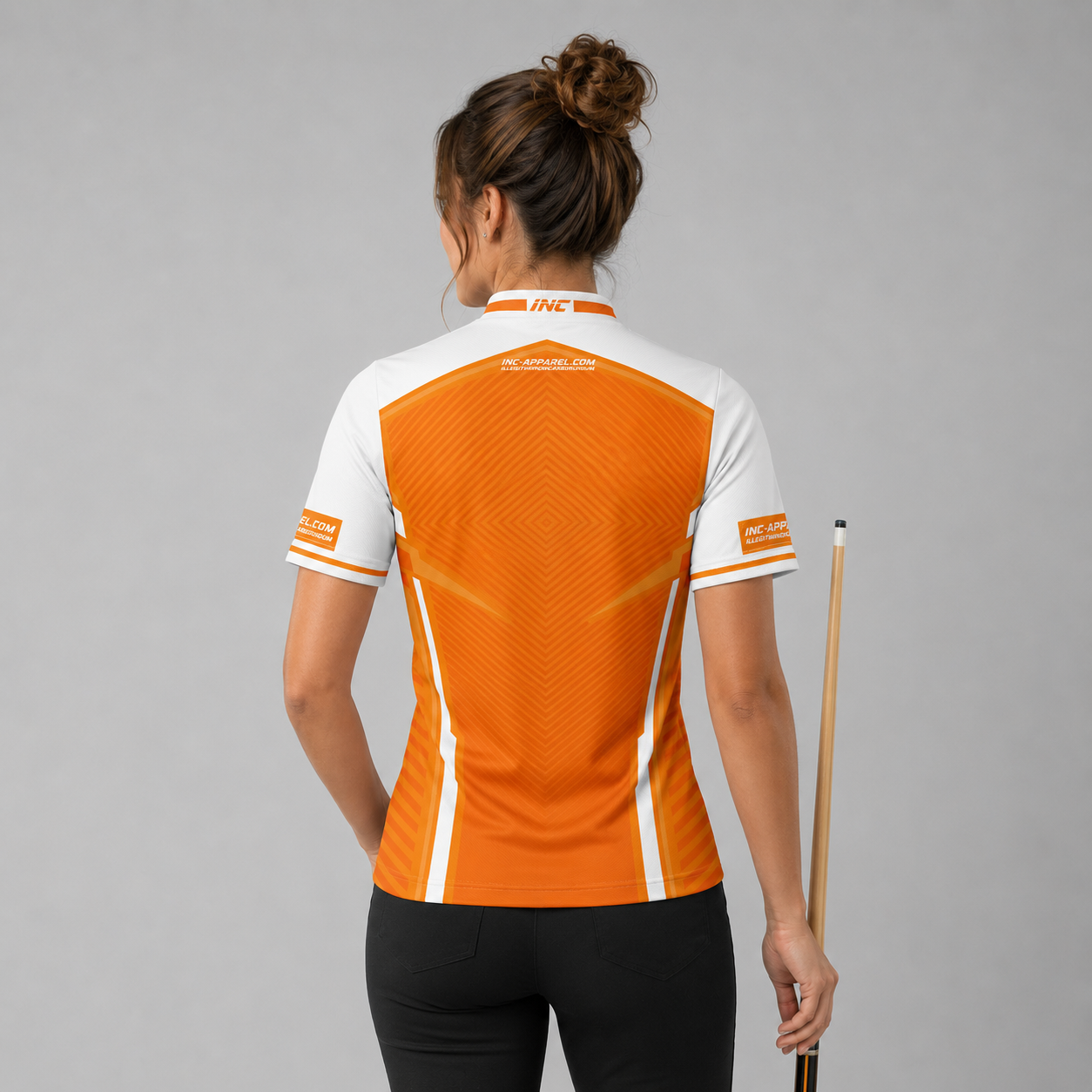 Back view of the Womens Terminare orange and white darts and pool shirt, showing the clean continuation of the athletic graphic pattern across the back.