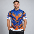 Front view of the TRADE Official Boundary Park Youth Darts Academy Christmas Shirt featuring a festive blue and orange winter scene with reindeer antlers, snowflakes, pine trees, official academy crest, blue zip collar, INC sleeve logos, and Controlled Climate lower hem