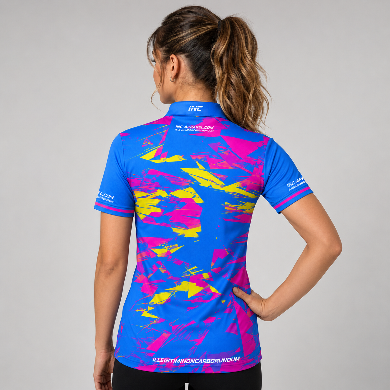 ack view of the INC-APPAREL Womens Vesanus darts and pool shirt, showing the continuous blue and pink geometric pattern.