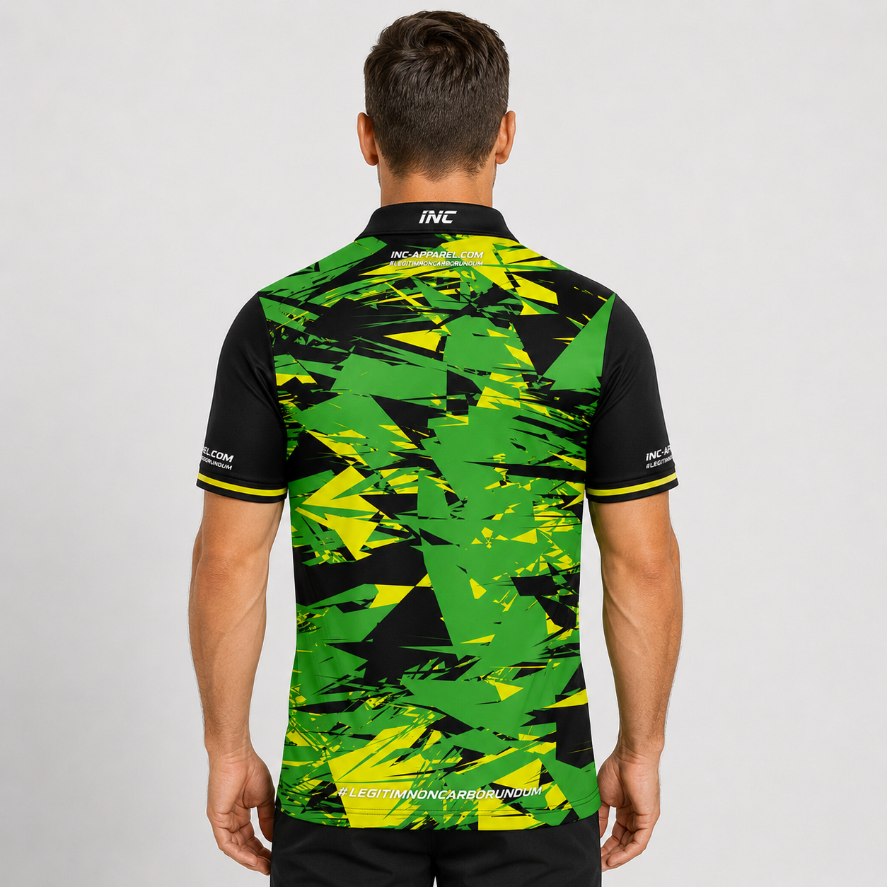 Back view of the INC-APPAREL Vesanus Green, Yellow, and Black Darts Pool Academy Shirt showing the continuous sublimated pattern.