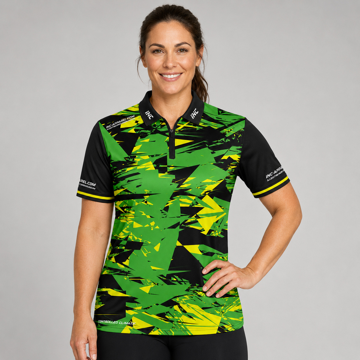 Front view of the INC-APPAREL Womens Vesanus Darts and Pool Academy Shirt in a bold green, yellow, and black geometric design.