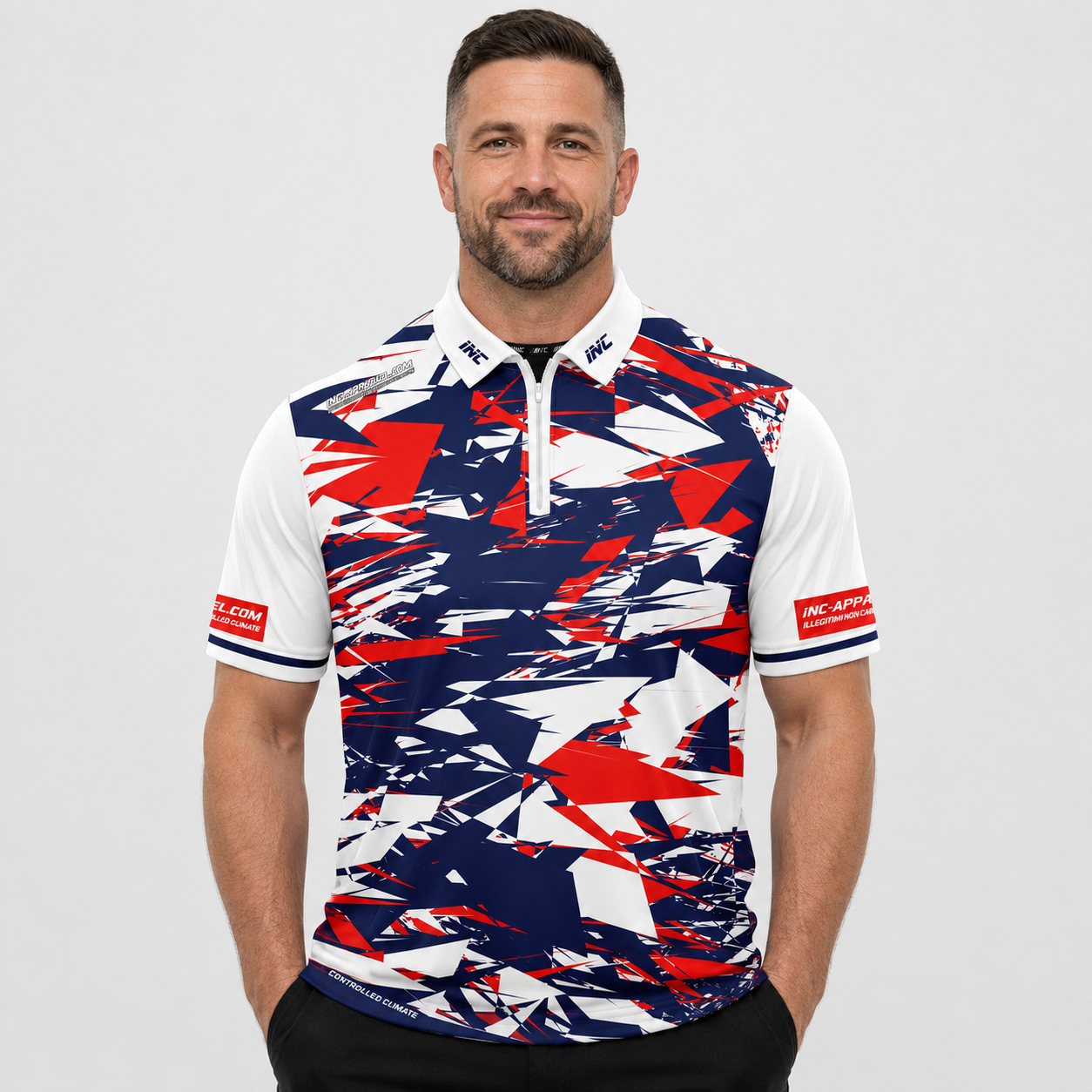 Front view of the INC-APPAREL Vesanus darts and pool shirt, featuring a sharp red, white, and blue geometric abstract pattern.