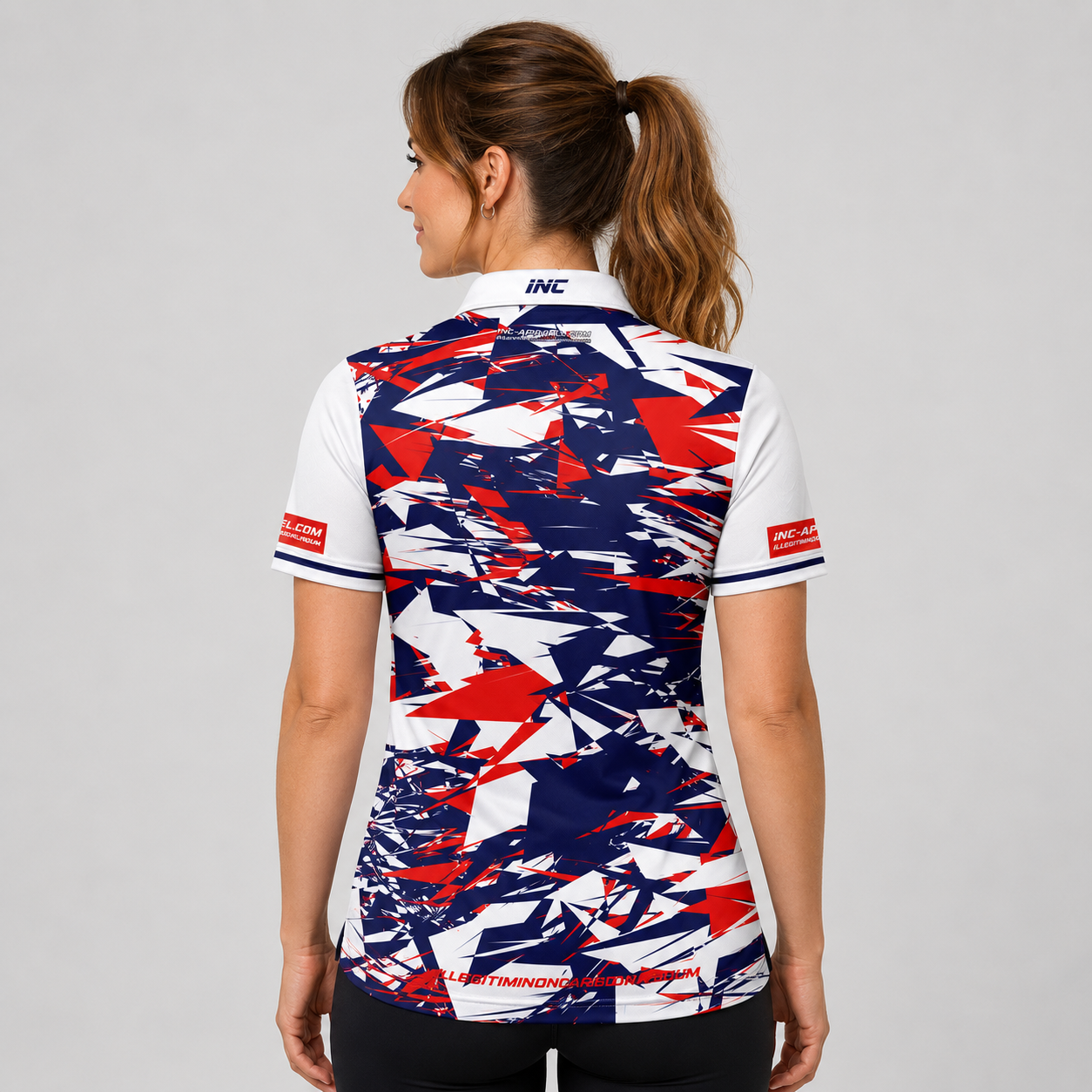 Back view of the INC-APPAREL Womens Vesanus darts and pool shirt showing the continuous red, white, and blue performance fabric design.