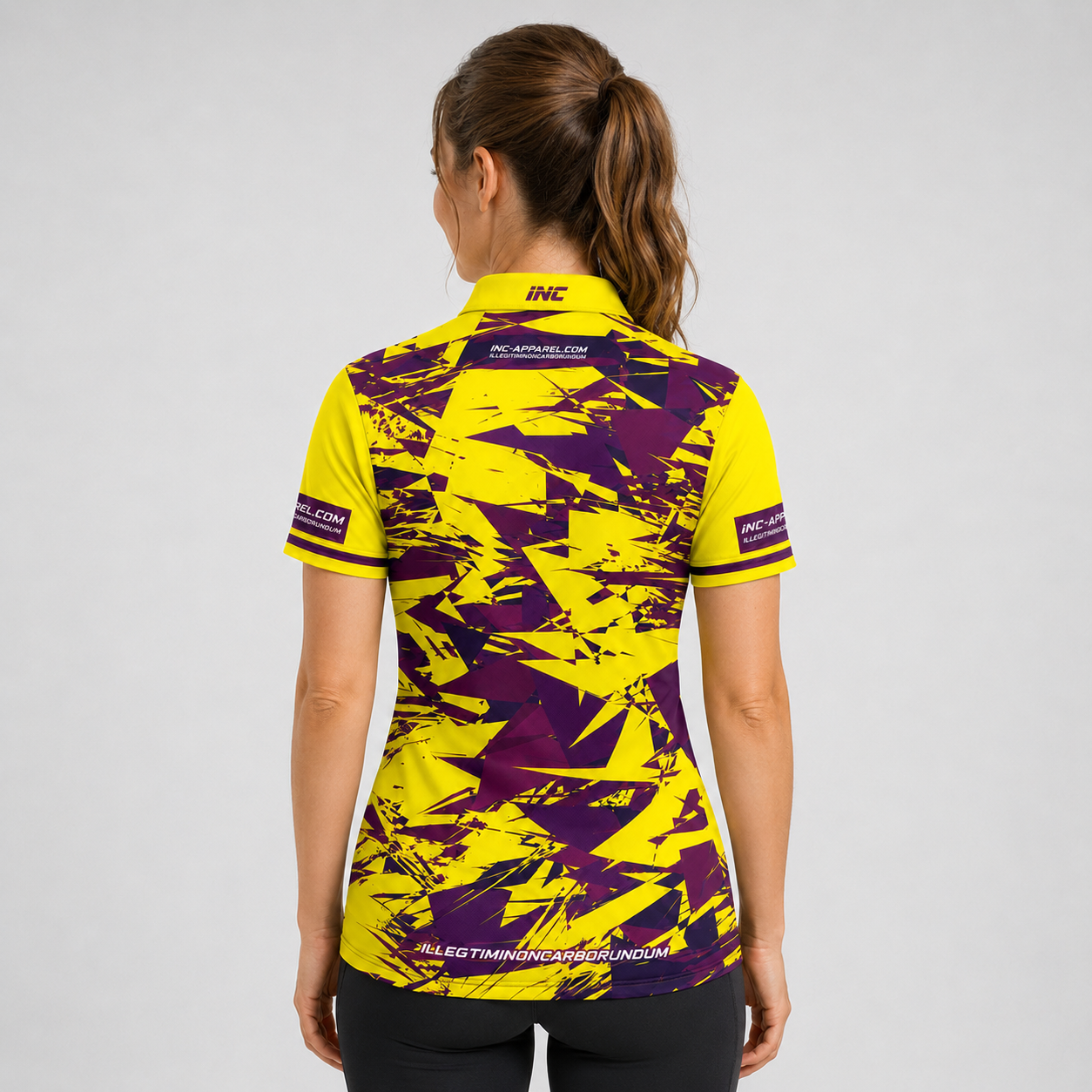 Back view of the INC-APPAREL Womens Vesanus Darts and Pool Academy Shirt showing the continuous sublimated yellow performance design.